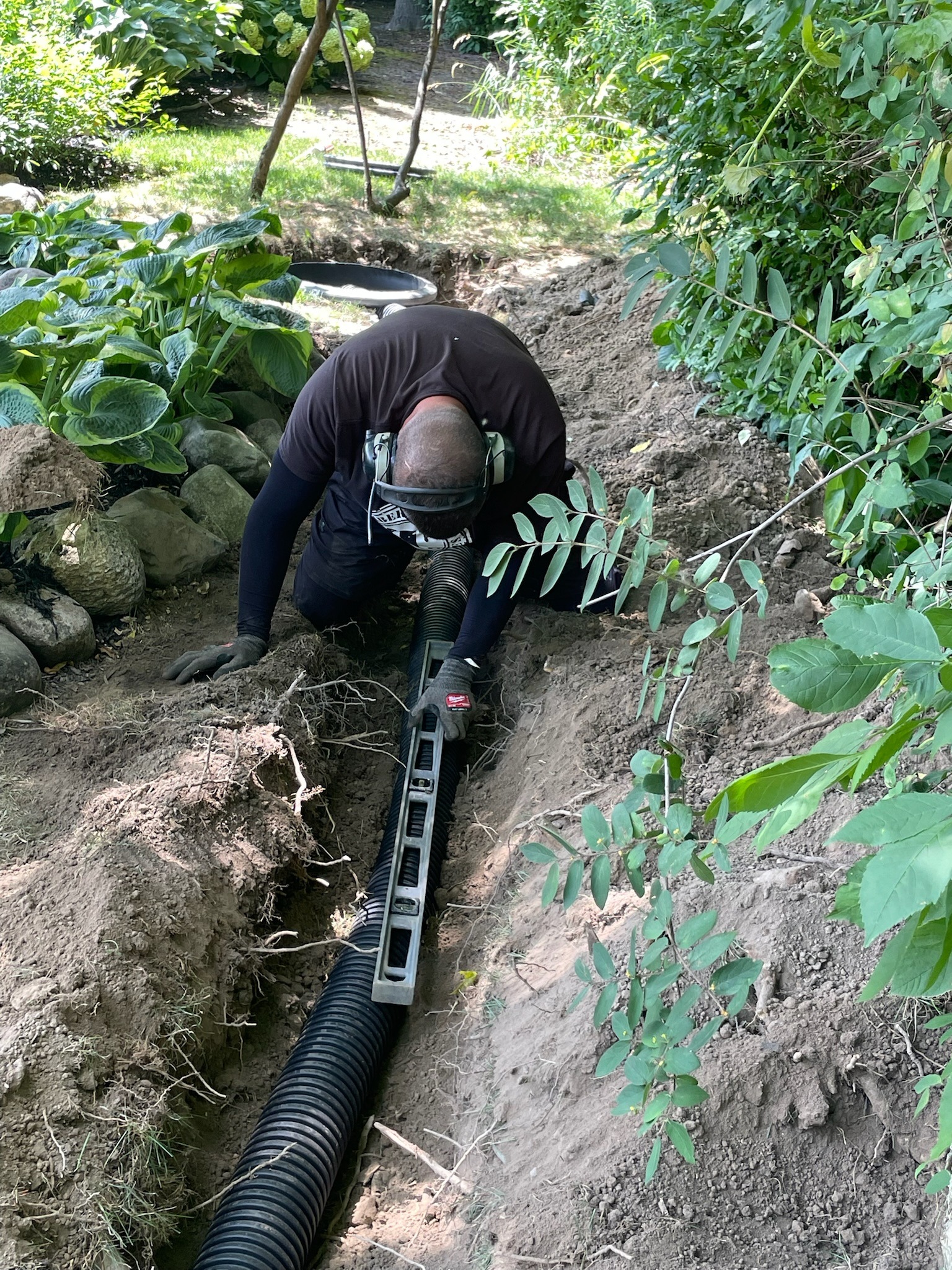Drainage trench and pipe installation by Timberline Outdoor Services