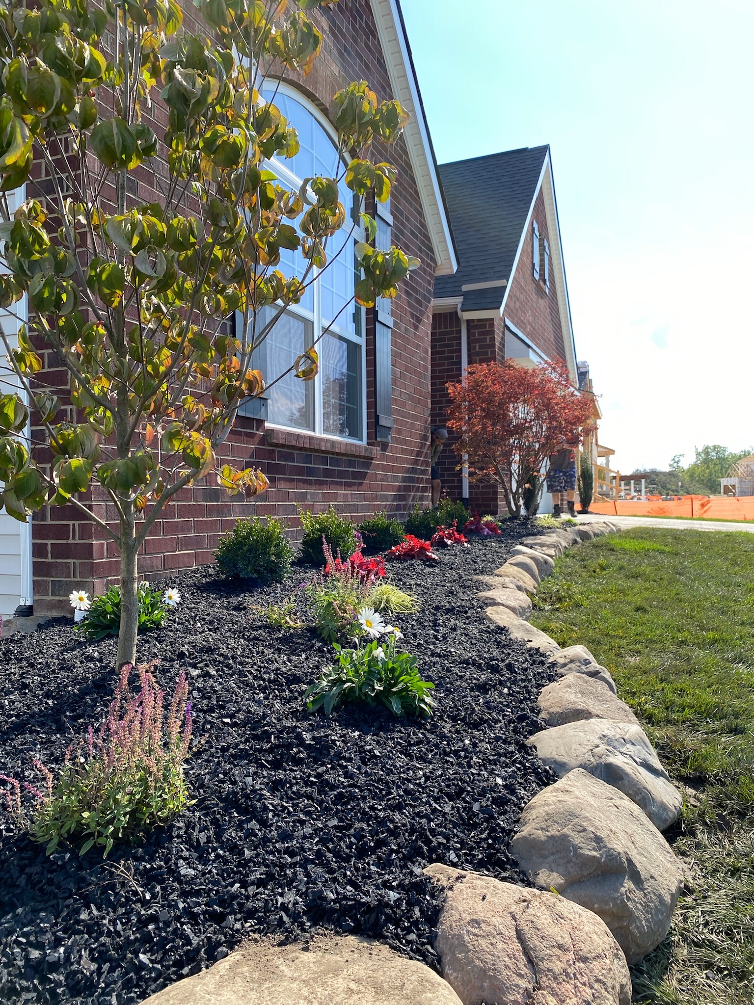 Fresh mulch and flower bed maintenance by Timberline Outdoor Services